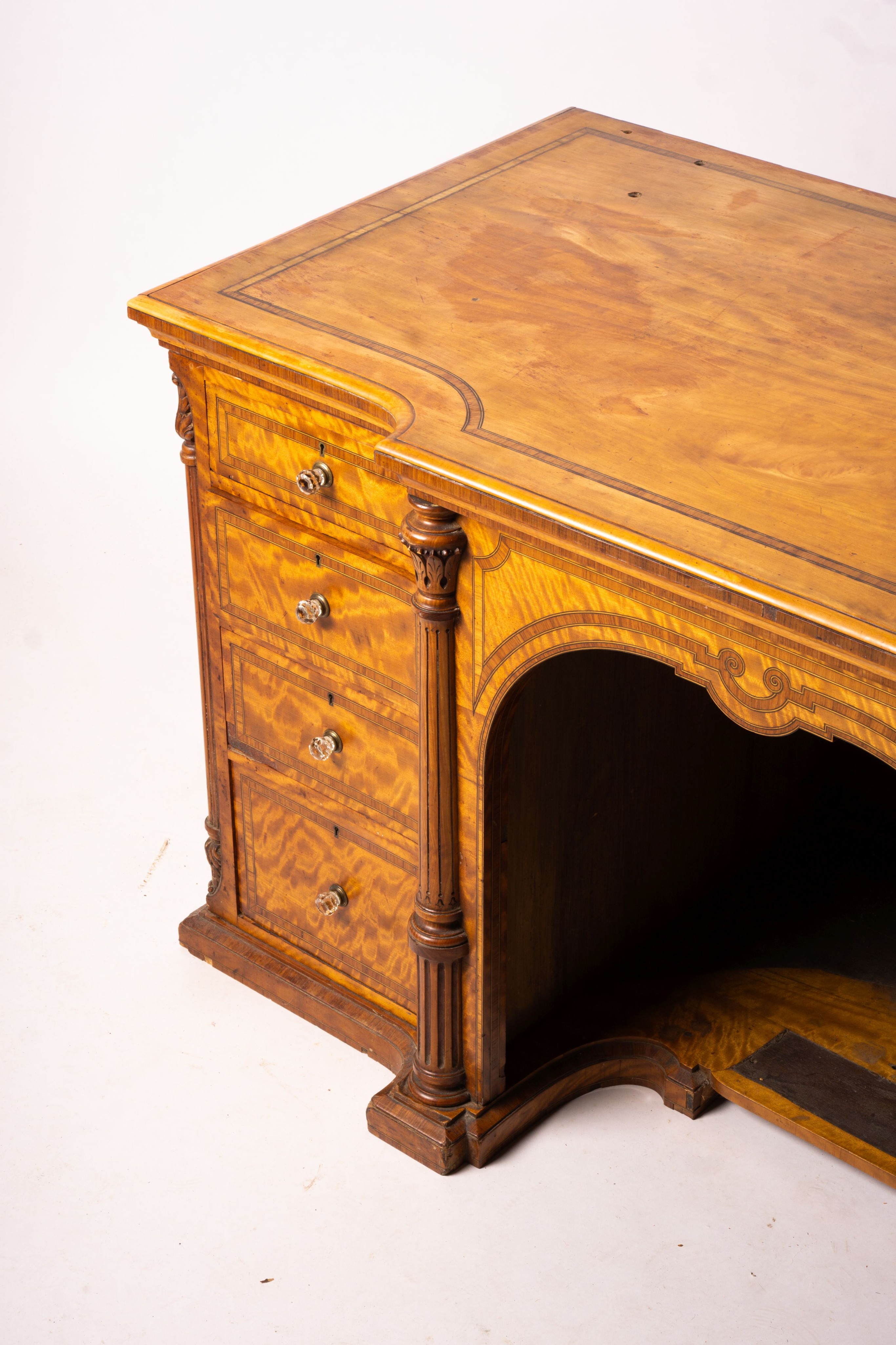 A late Victorian banded satinwood kneehole desk, width 138cm, depth 67cm, height 71cm